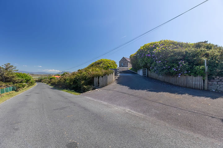 Road and entrance to drive at Golden Strand View cottage